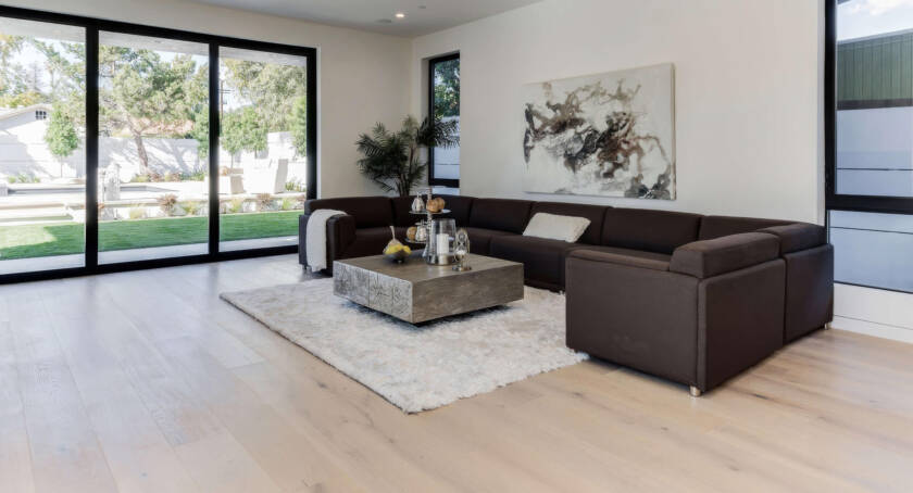 Spacious living room featuring durable oak hardwood flooring with natural grain