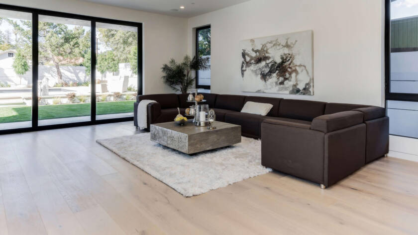 Spacious living room featuring durable oak hardwood flooring with natural grain