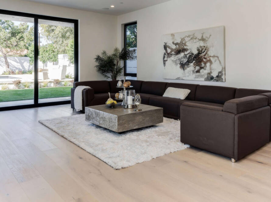 Spacious living room featuring durable oak hardwood flooring with natural grain